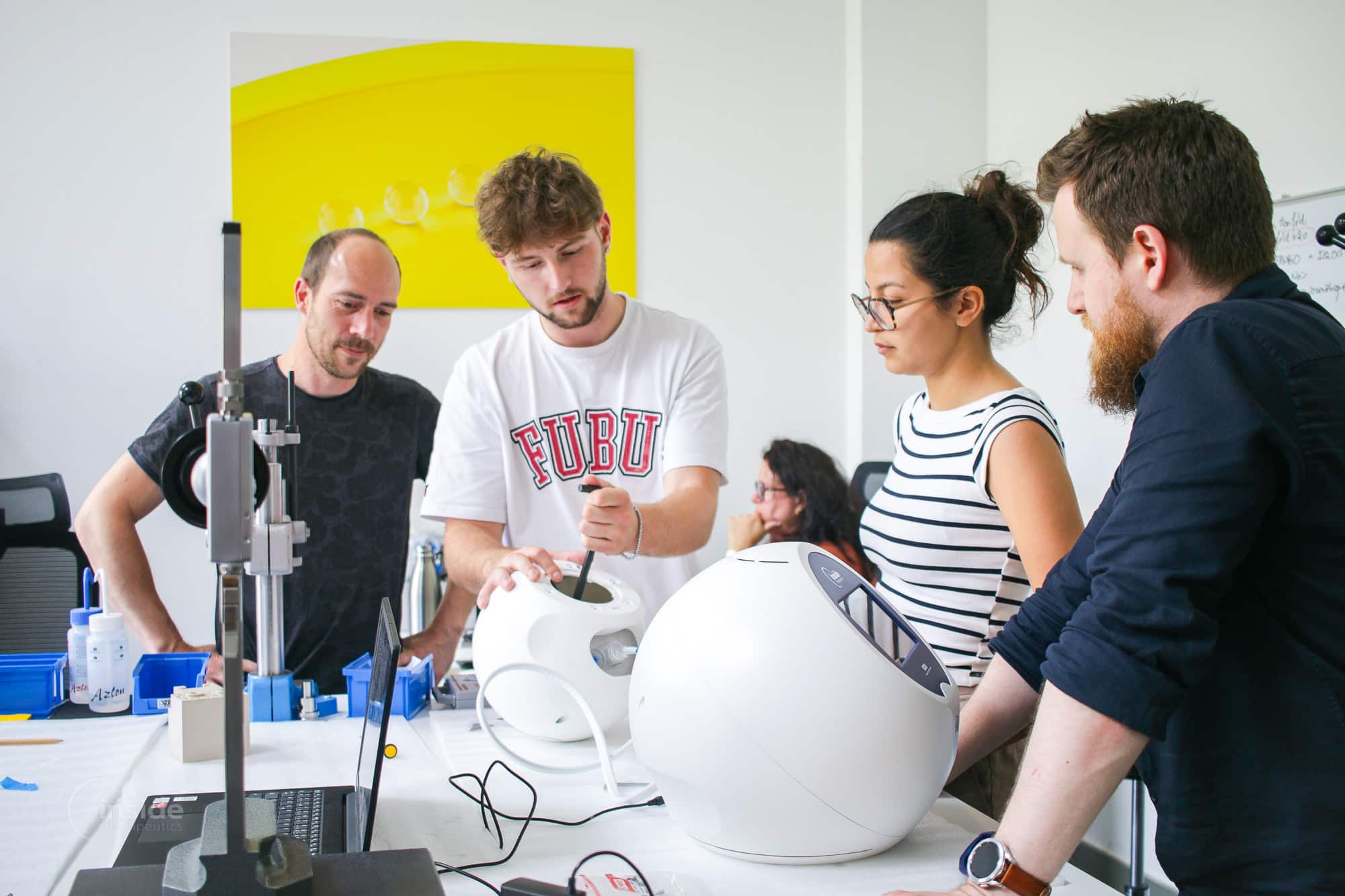 Inside Therapeutics team members are dedicated to creating the next-generation machine for nanoparticle manufacturing.
